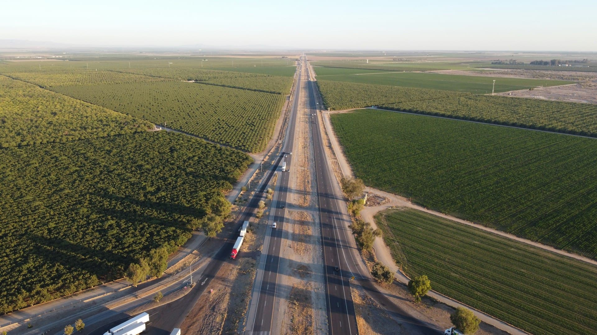 Aerial view of Bakersfield California farmland and highway in Central Valley