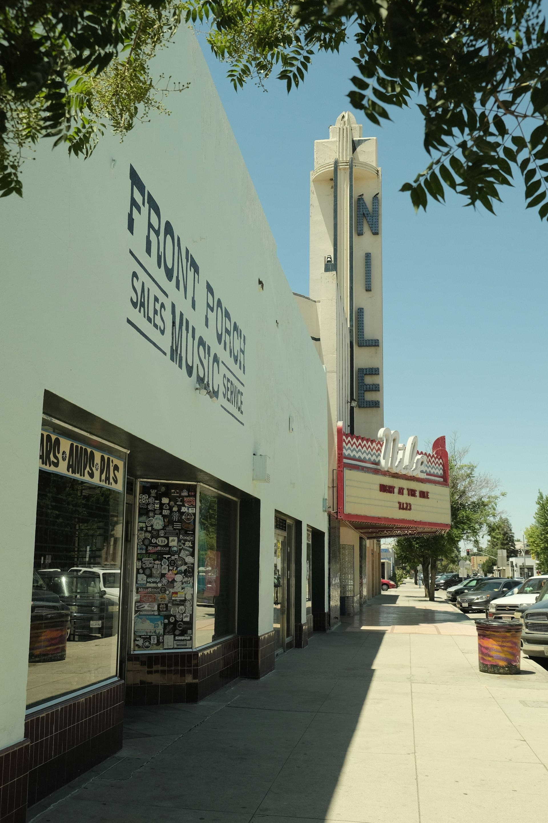 Nile Theater and Front Porch Music store on street in Bakersfield California