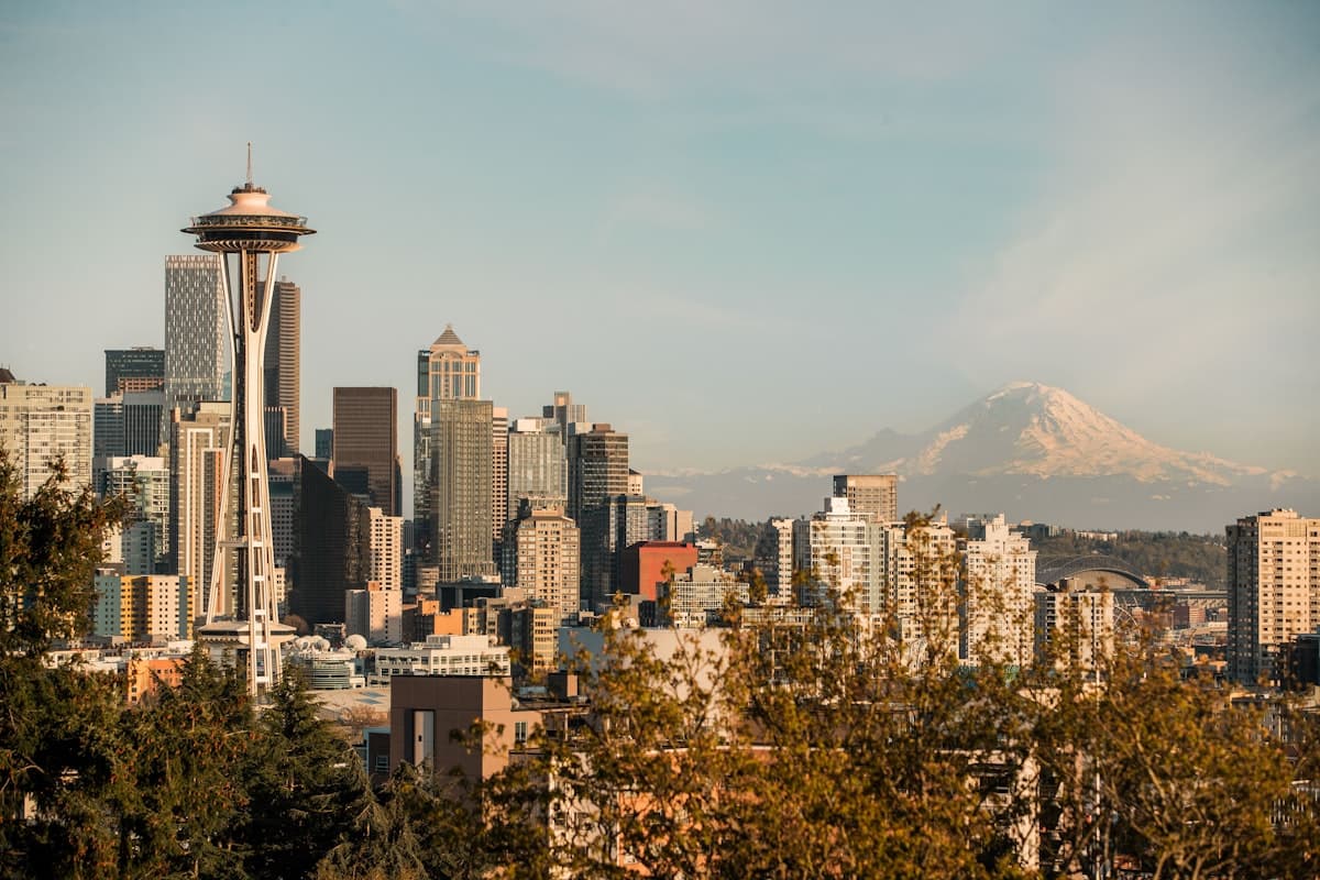 Seattle skyline with Space Needle and Mount Rainier visible from the greater Bellevue area