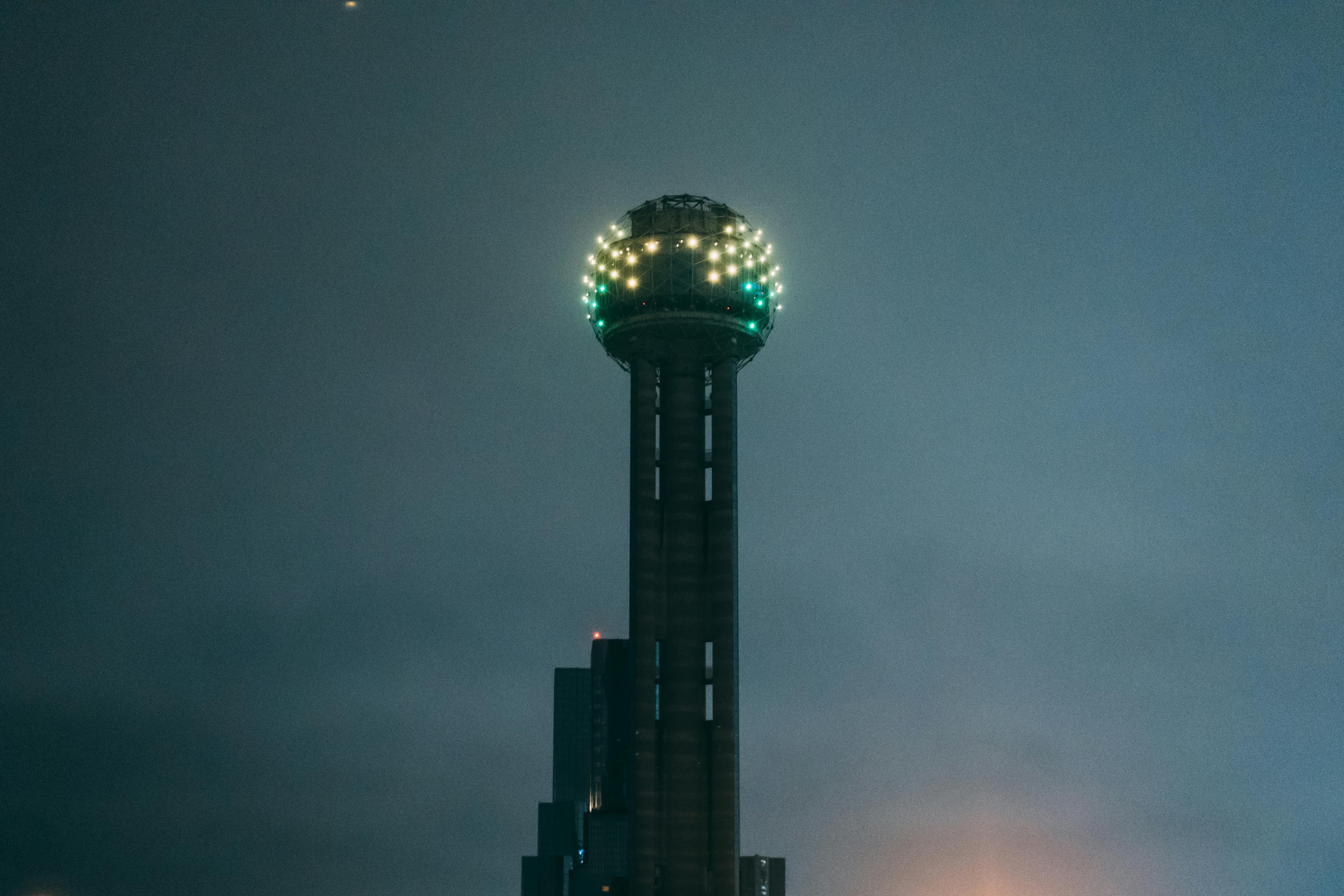 Reunion Tower illuminated at night, iconic Dallas Texas landmark