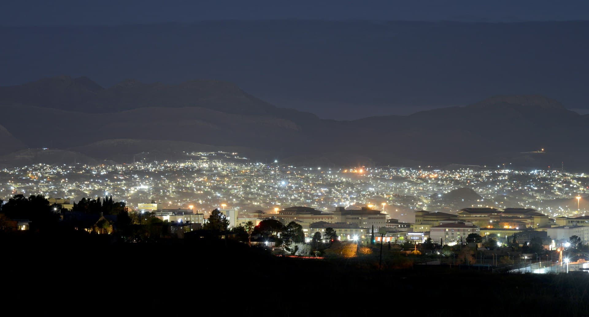 Night view of El Paso and Juarez from Franklin Mountains showing city lights