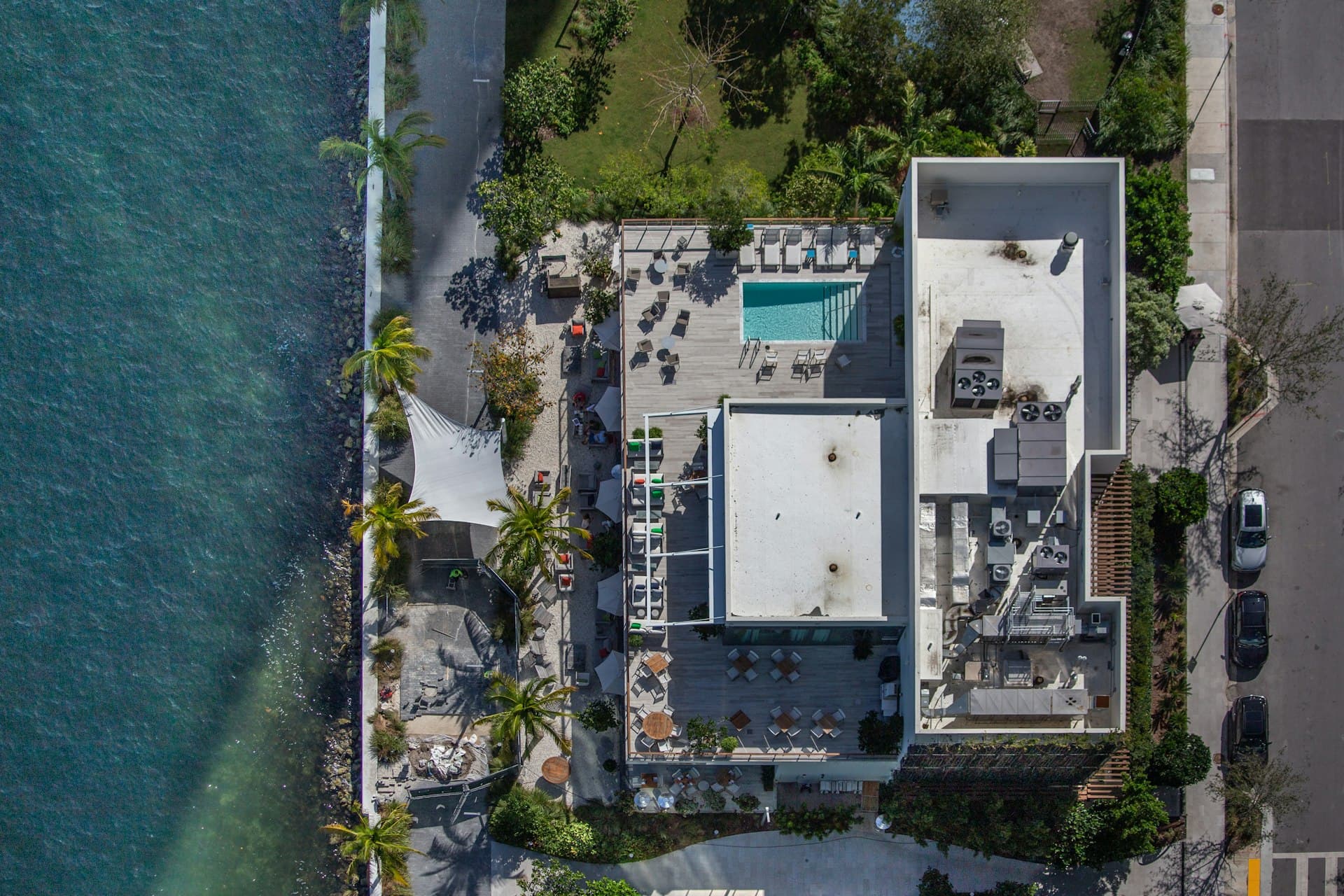 Aerial view of Miami waterfront property with flat roofs and HVAC units