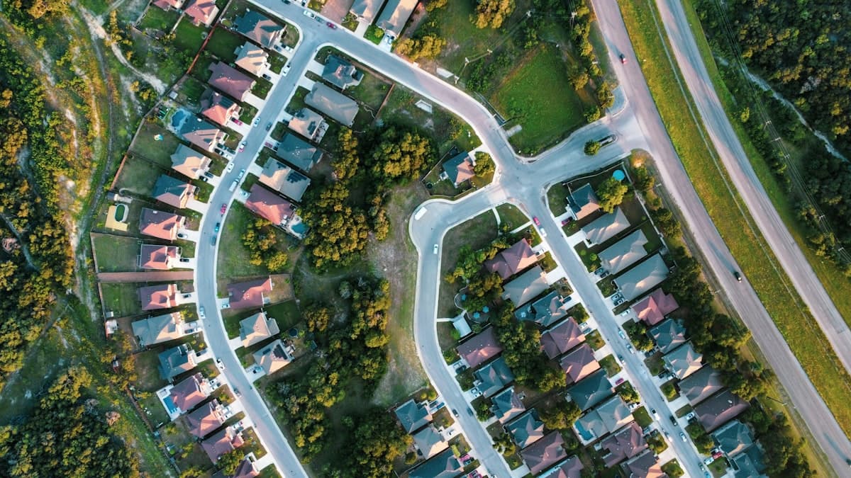 Aerial view of suburban Texas neighborhood with winding streets and residential homes