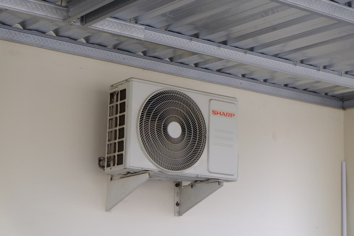 Outdoor air conditioning unit mounted on wall for residential cooling