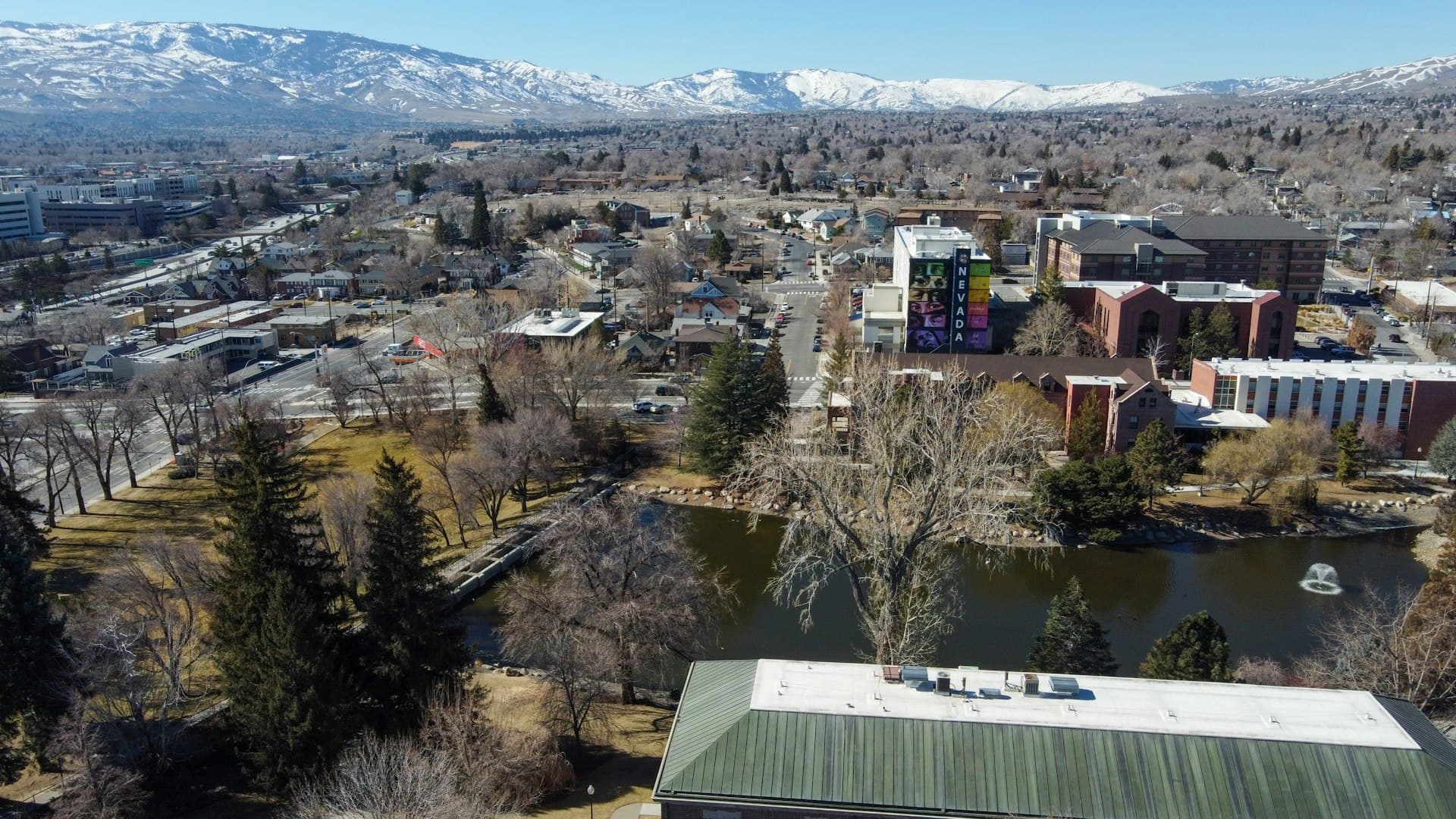 Aerial view of University of Nevada Reno campus and surrounding residential neighborhoods with Sierra Nevada mountains