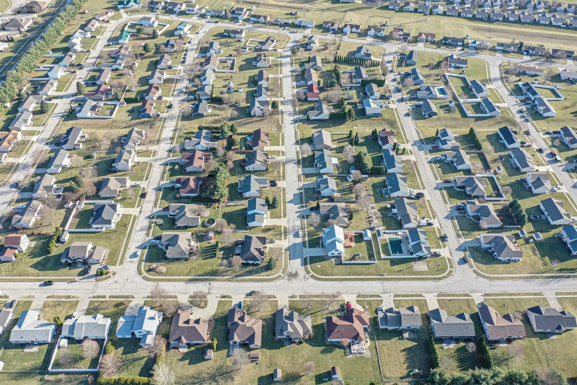 Aerial view of Illinois residential neighborhood showing rooftops and streets