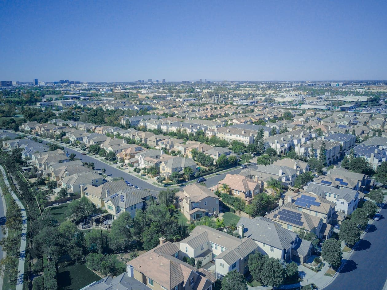 Aerial view of California suburban homes with solar panels showcasing sustainable living