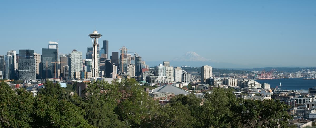 Panoramic view of Seattle skyline with residential neighborhoods and Puget Sound