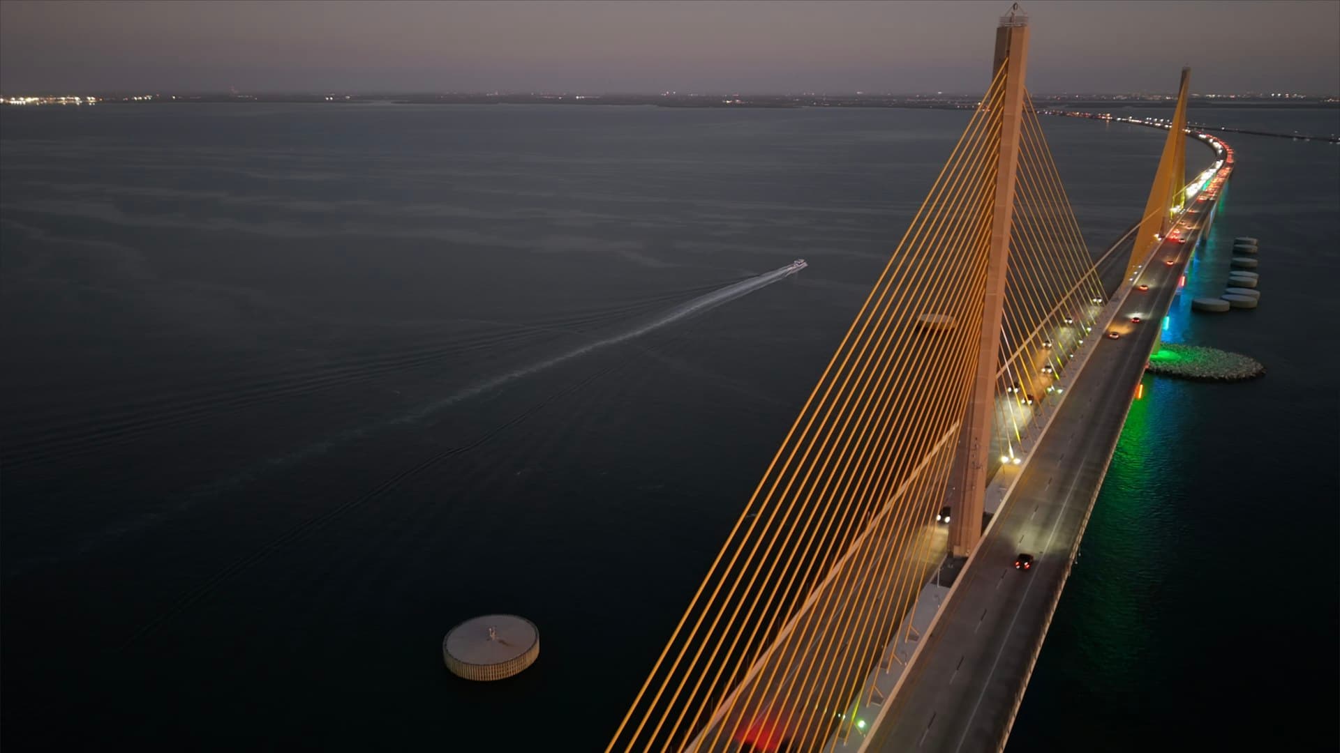 Sunshine Skyway Bridge over Tampa Bay at twilight with illuminated cables
