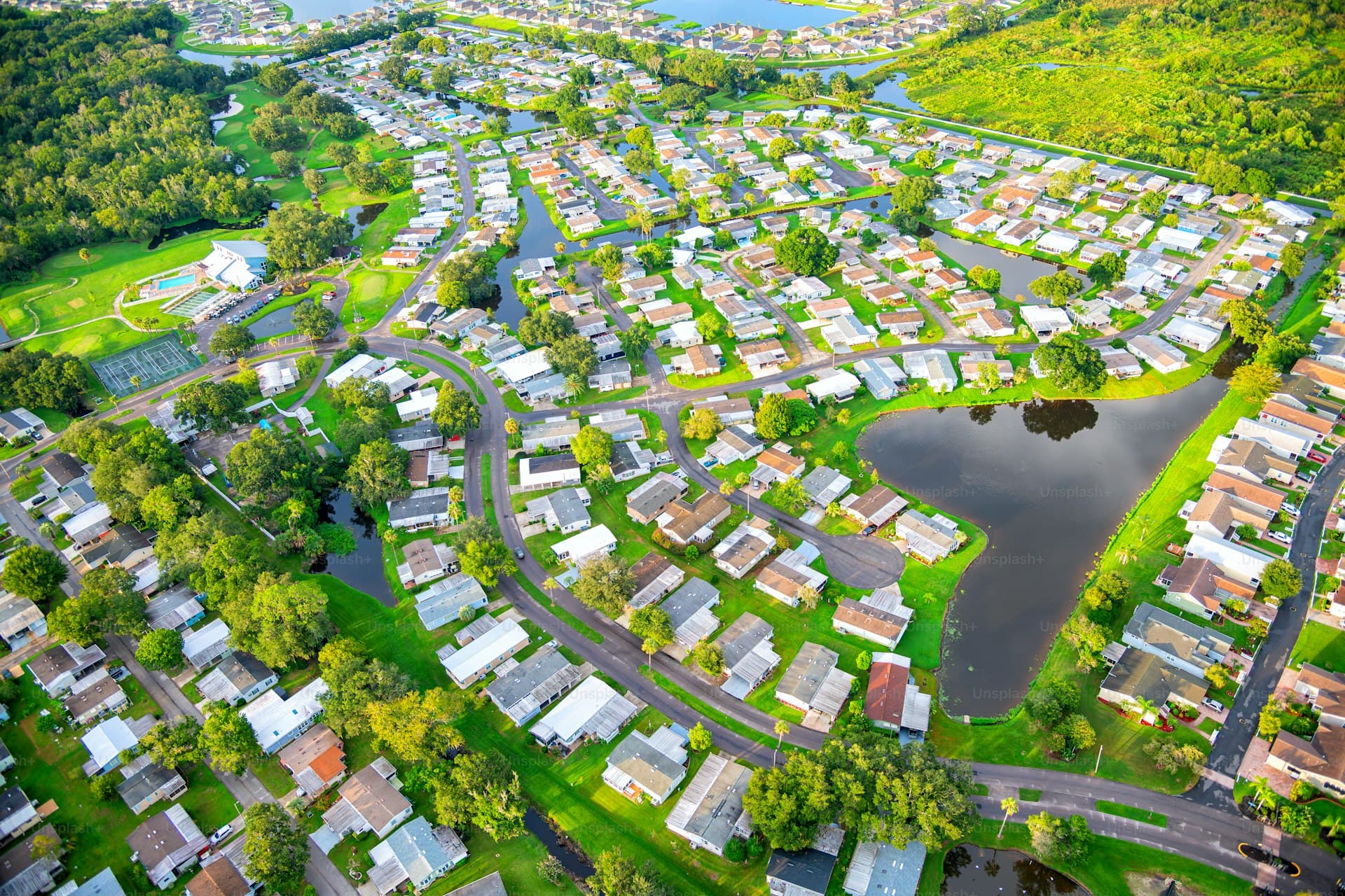 Aerial view of suburban Tampa housing development with lakes and green spaces
