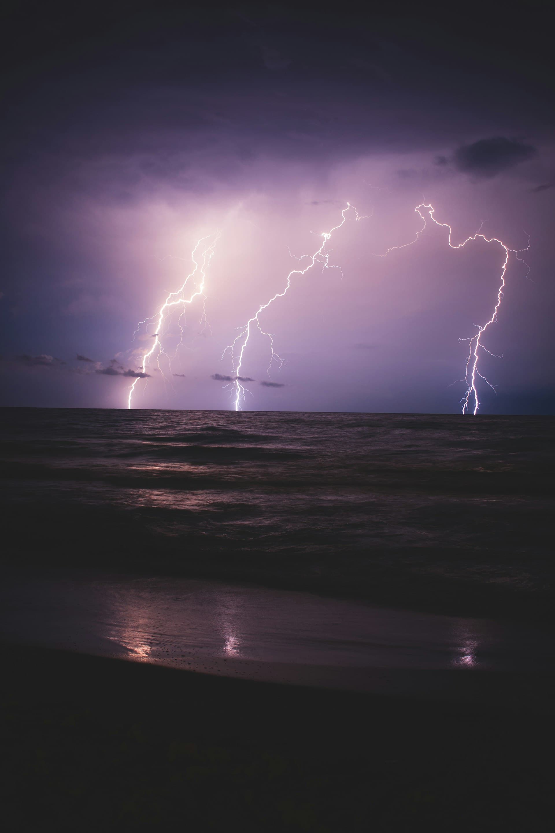 Florida tropical storm with lightning over the ocean at night